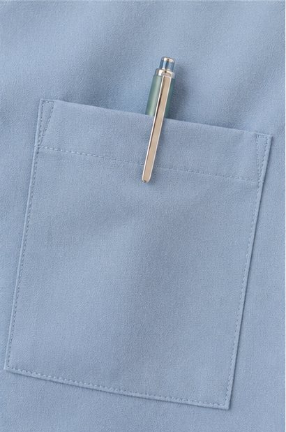 A chest pocket holding a pen